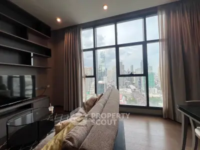 Luxurious living room with stunning city view through large windows, modern furniture and elegant decor.