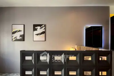 Modern interior with stylish wall art and sleek furniture in a contemporary setting.