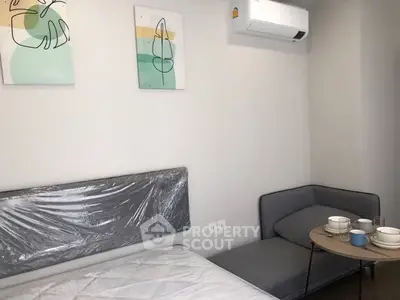 Modern bedroom with stylish decor and cozy seating area