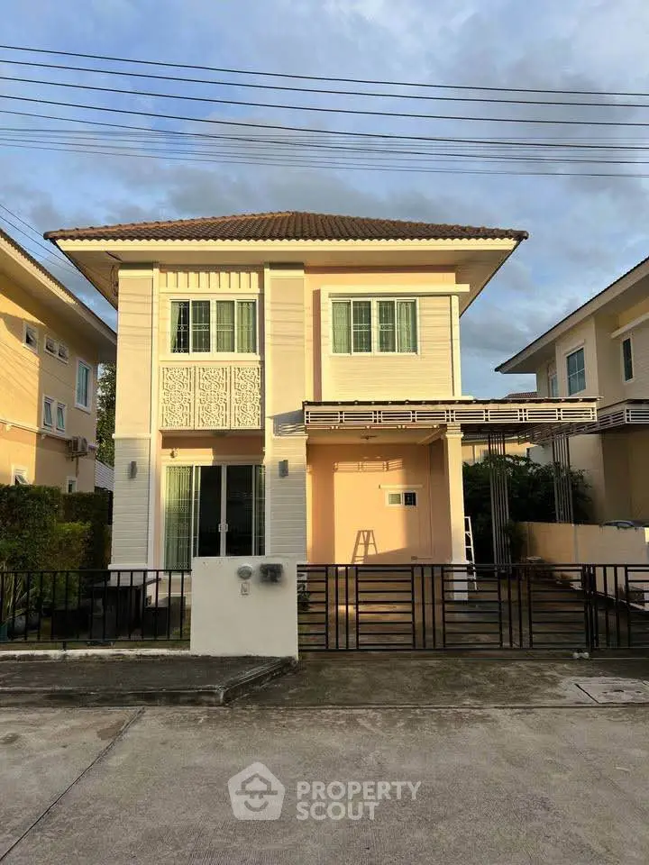 Charming two-story house with modern design and spacious outdoor area in a serene neighborhood.