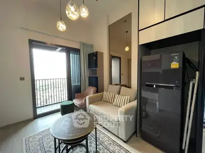 Modern living room with balcony, stylish furniture, and elegant lighting.