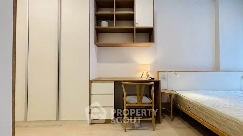 Modern bedroom with built-in storage and cozy workspace