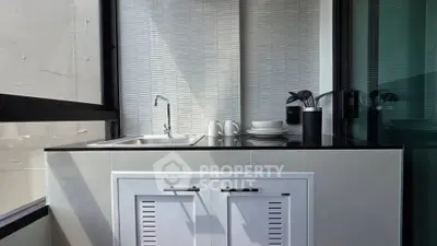 Modern kitchen with sleek design and ample natural light