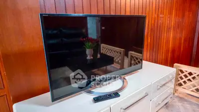 Modern living room with sleek TV and stylish decor