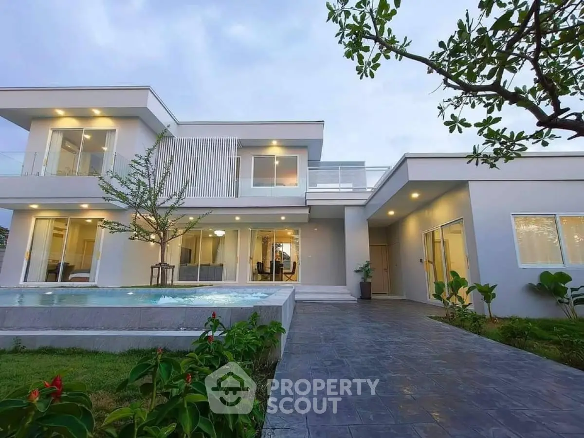 Modern luxury home with sleek architecture and lush garden