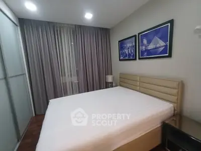Modern bedroom with stylish decor and large bed in a cozy apartment.