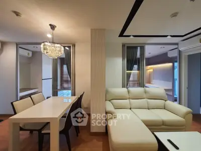 Modern living room with elegant dining area and stylish lighting