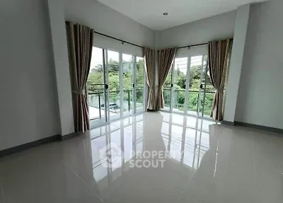 Spacious corner unit with large windows offering lush green views and abundant natural light.