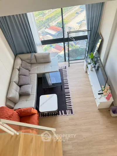 Spacious modern living room with large windows and stylish furniture