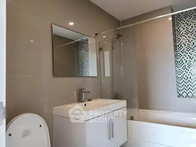Modern bathroom with sleek fixtures and stylish tile accents