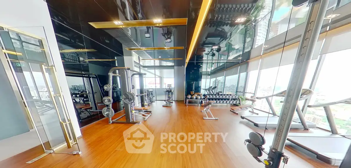 Luxurious high-rise gym with panoramic city views and state-of-the-art fitness equipment.