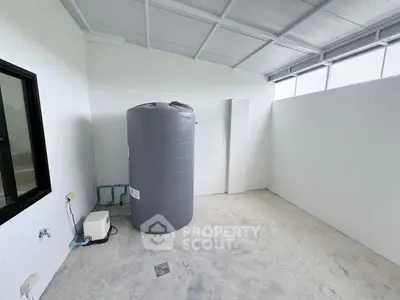 Spacious utility room with water tank and modern design