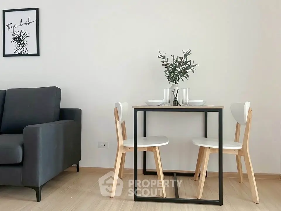 Modern minimalist dining area with sleek furniture and stylish decor in a cozy apartment.