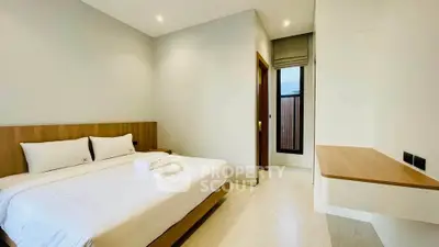 Modern minimalist bedroom with cozy bed and natural light