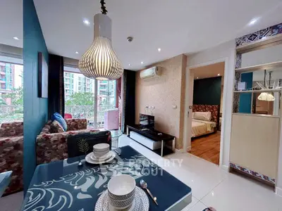 Modern open-plan living room with stylish decor and balcony view