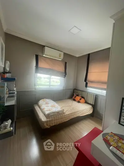 Cozy bedroom with natural light and modern decor
