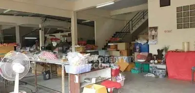 Spacious storage area with various items and staircase, ideal for organizing and utility purposes.