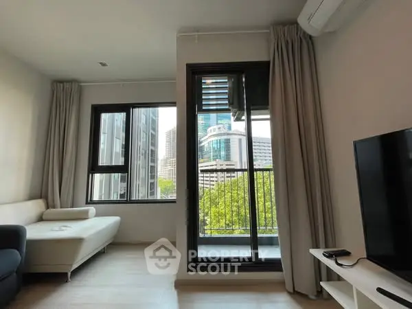 Modern living room with balcony view in urban apartment