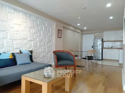 Modern living room with stylish decor and open kitchen layout