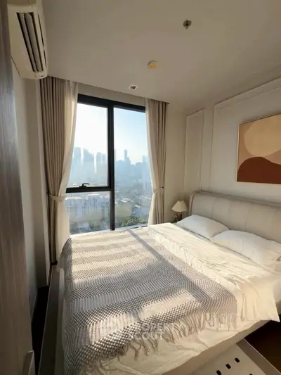 Luxurious bedroom with stunning city view and elegant decor