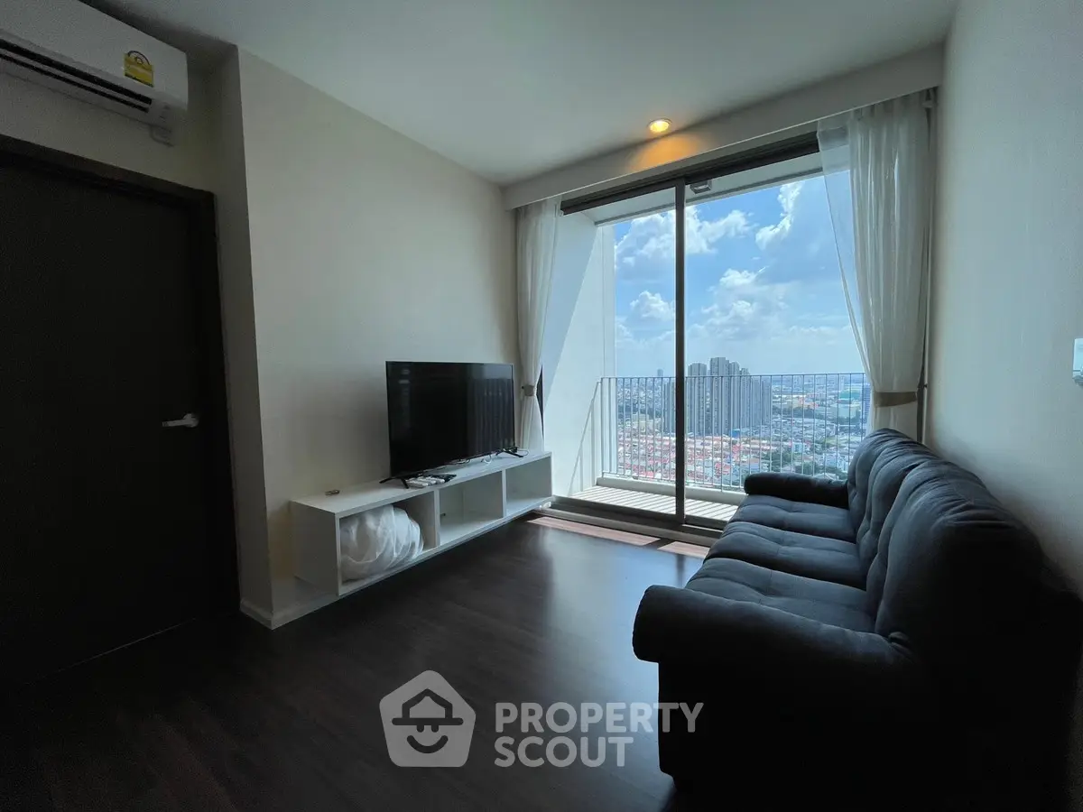 Modern living room with stunning city view and cozy seating area