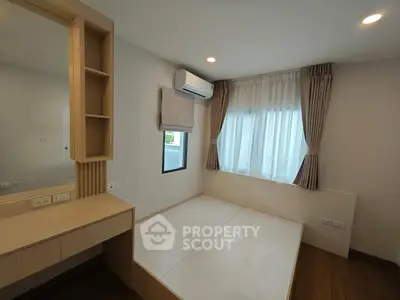 Modern bedroom with built-in storage and natural light