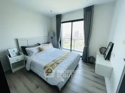 Modern bedroom with large window and stylish decor