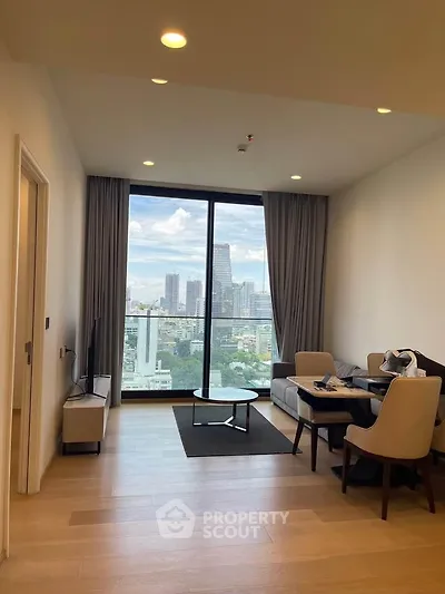 Modern living room with stunning city view and elegant furnishings