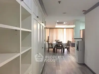 Spacious open-plan living area with modern furnishings and ample natural light.