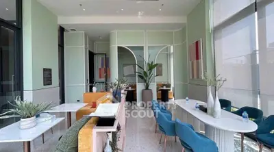 Modern living room with stylish decor and large windows for natural light.