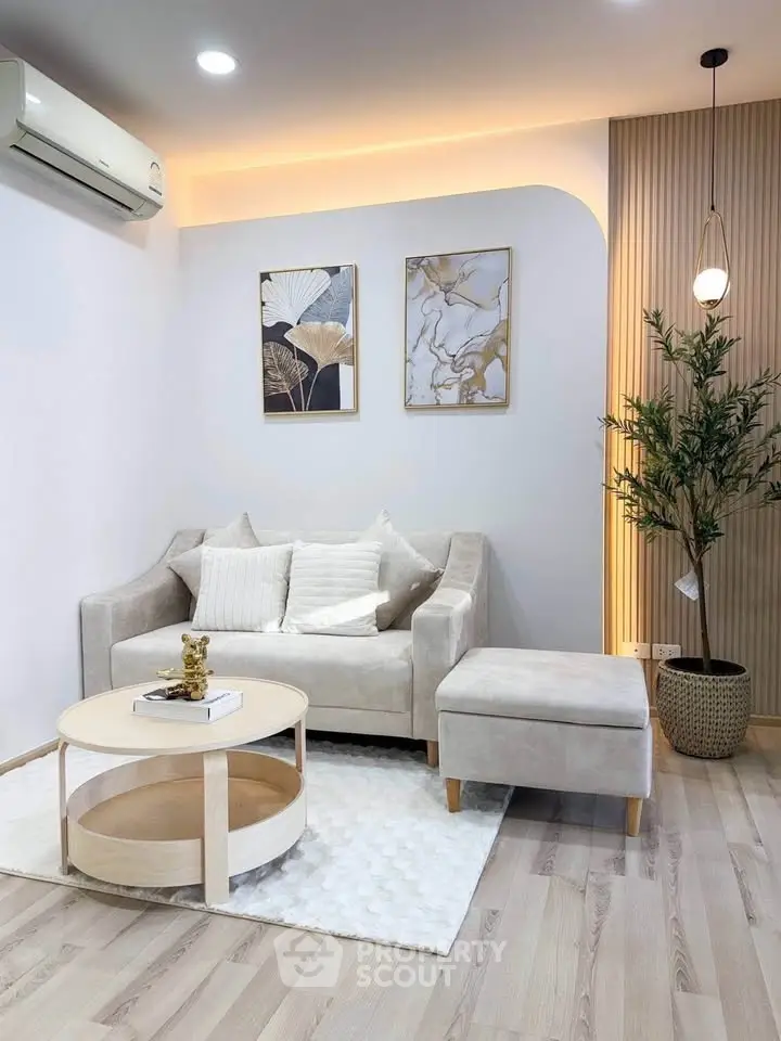 Modern living room with elegant decor, featuring a cozy sofa, stylish coffee table, and ambient lighting.