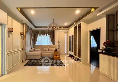 Luxurious living room with elegant chandelier and plush seating in a modern home.