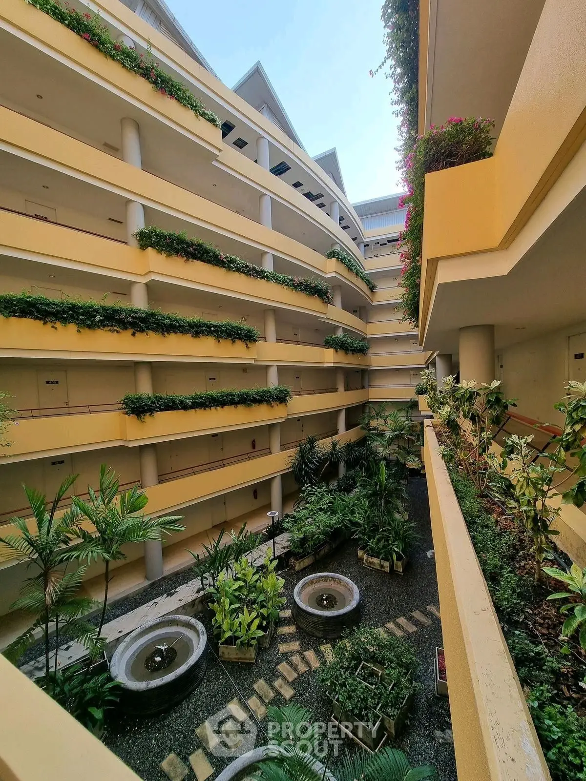 Stunning multi-level building with lush greenery and modern design