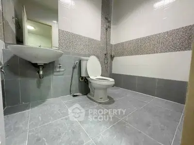 Modern bathroom with sleek tile design and contemporary fixtures