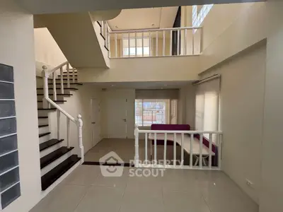 Spacious modern interior with mezzanine and elegant staircase