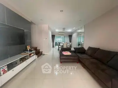 Spacious modern living room with sleek furniture and open layout