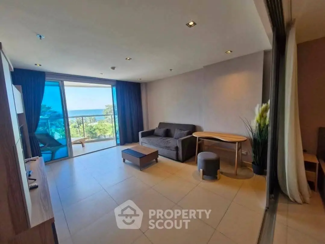 Spacious living room with ocean view and modern furnishings
