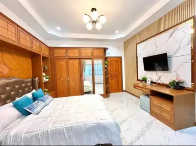 Luxurious bedroom with elegant wood finishes and modern decor