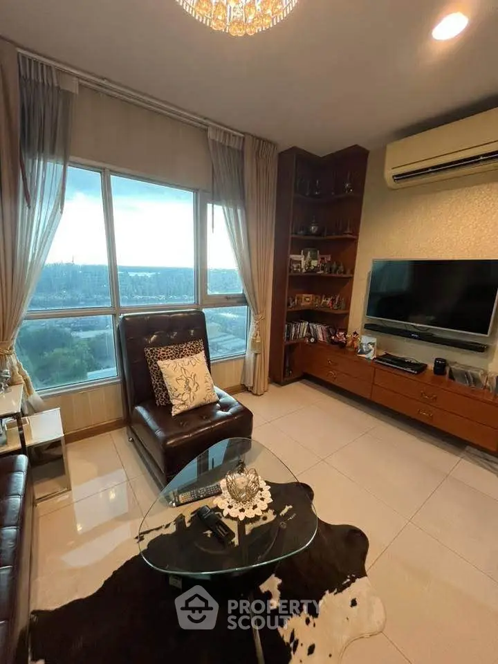 Luxurious living room with stunning city view, elegant decor, and modern amenities for ultimate comfort.