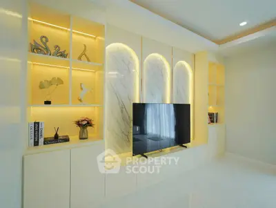 Modern living room with elegant built-in TV unit and ambient lighting