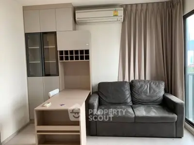 Modern living room with sleek furniture and air conditioning, perfect for urban living.