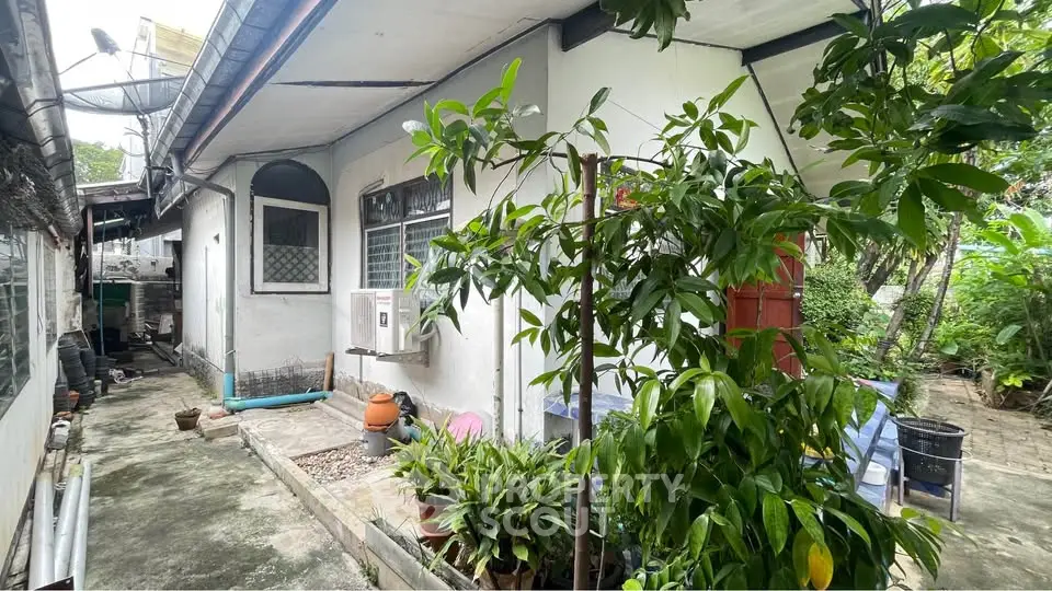 Charming exterior view of a cozy home with lush greenery and inviting outdoor space.
