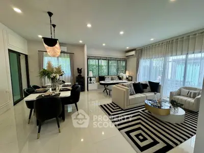 Luxurious open-plan living room with elegant dining area and stylish decor