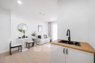 Modern minimalist living room with sleek kitchenette and stylish decor