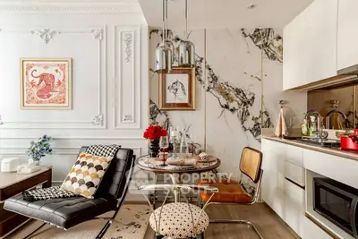 Luxurious modern living room with elegant decor and marble accents, perfect for stylish urban living.