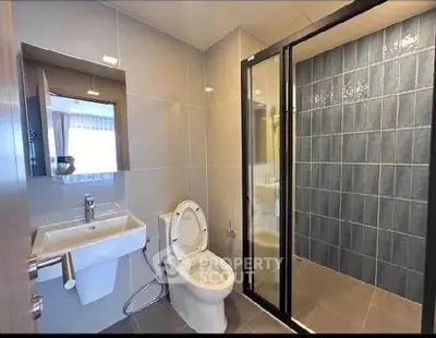 Modern bathroom with sleek design and glass shower enclosure