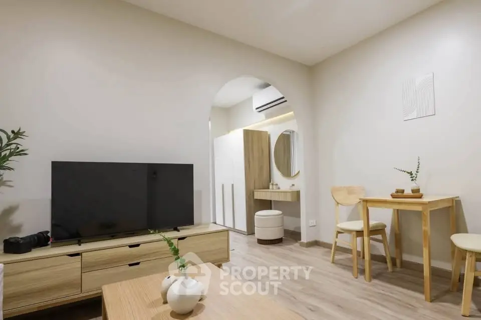 Modern living room with minimalist decor and wooden furniture