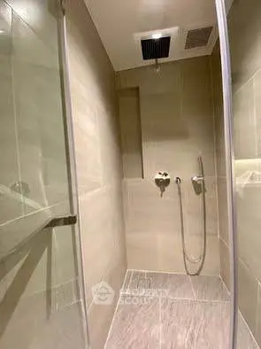 Modern bathroom with sleek shower design and neutral tiles