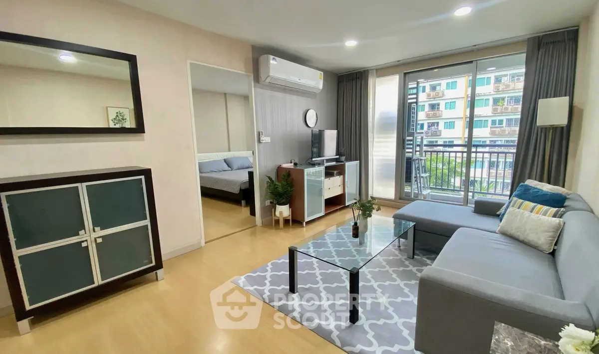 Modern living room with cozy sofa and balcony view in urban apartment