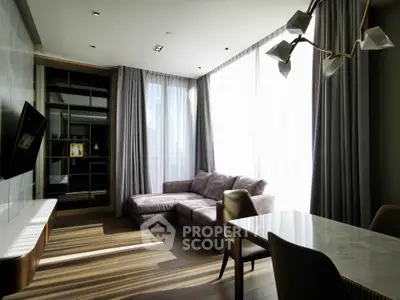 Modern living room with large windows and stylish furniture